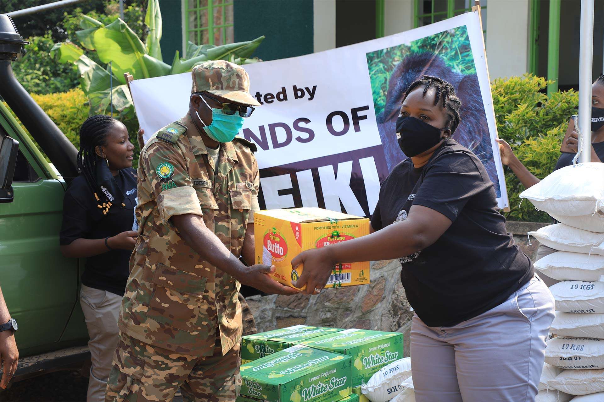 Lydia, CEO at Nkuringo Safaris & Lodges donating to Bwindi Rangers during Covid-19 lockdown. It's essential to choose a safari operator that supports local sustainable programs.
