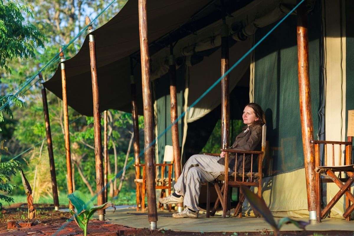 A Traveler relaxing at the safari camp after a game viewing experience - Reasons Choose a Local Safari Operator