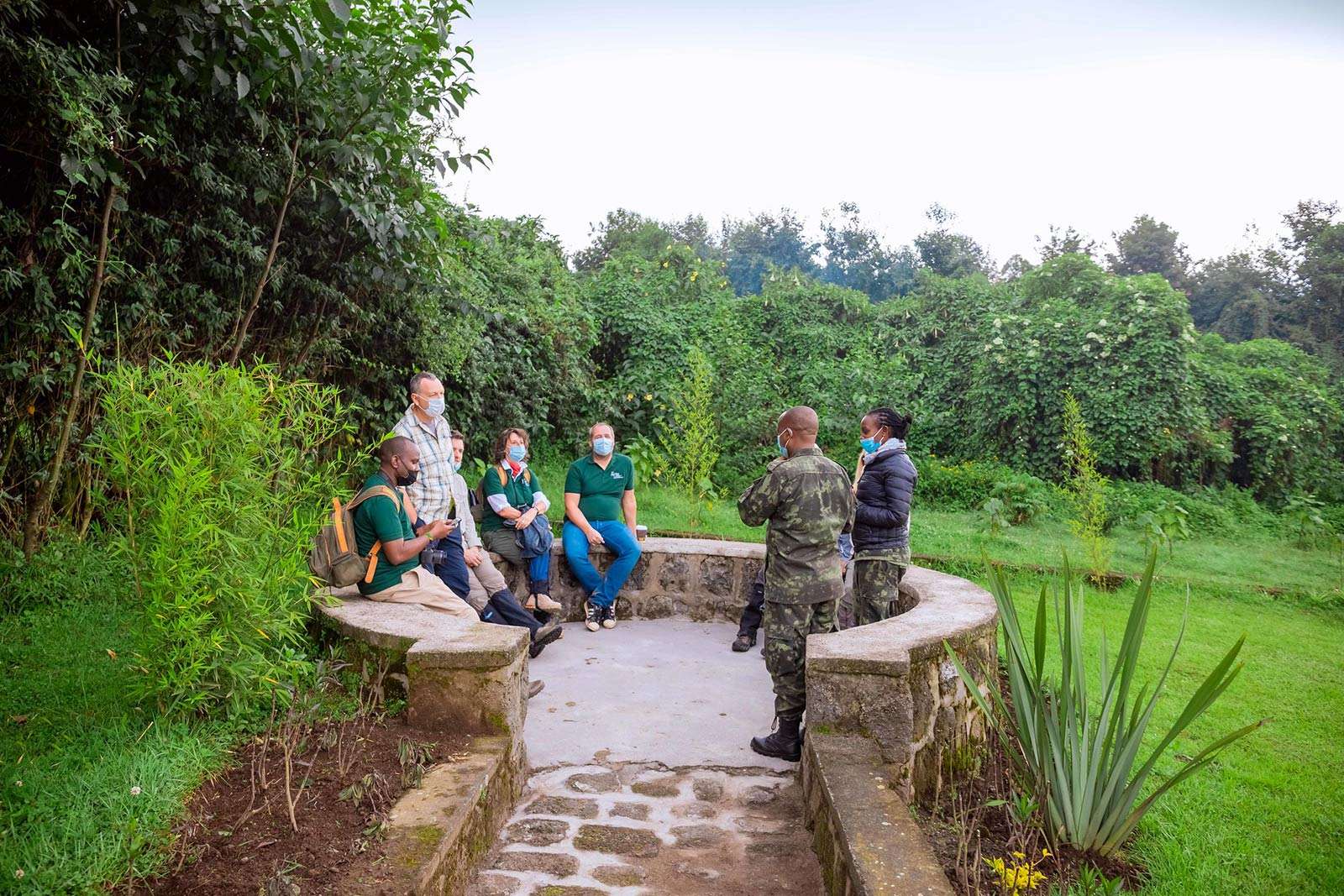 A ranger briefing trekkers before they set eyes on the gorillas. Gorilla tracking Trekking Regulations in Rwanda